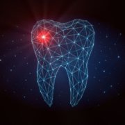 Die Illustration zeigt einen stilisierten Zahnumriss, der aus einem leuchtenden Netz aus feinen Linien und Punkten gebildet ist – fast wie eine 3D-Drahtgitter-Darstellung in Blau- und Cyan­tönen vor dunklem Hintergrund. Links oben im Zahn ist ein starker roter Lichtpunkt zu sehen, der einen Schmerzpunkt, eine Entzündung oder ein Problem im Zahn symbolisieren kann. Um den Zahn herum schweben verstreut weitere kleine Lichtpunkte, die an Sterne oder digitale Datenpunkte erinnern und dem Bild einen futuristischen, technischen Look verleihen.